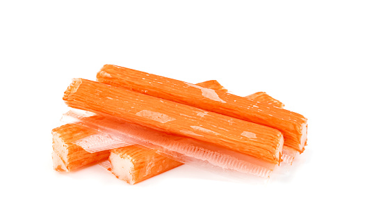 closeup crab sticks in packing isolated on white background
