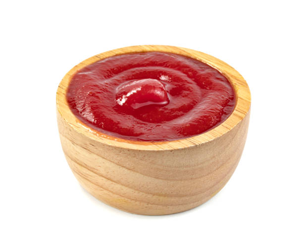 istock tomato sauce in wooden bowl isolated on white background 1615430669