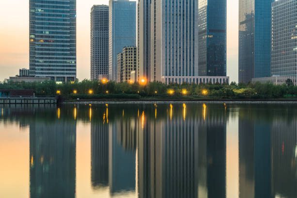 istock modern city waterfront downtown skyline at dusk, China. 1615448517