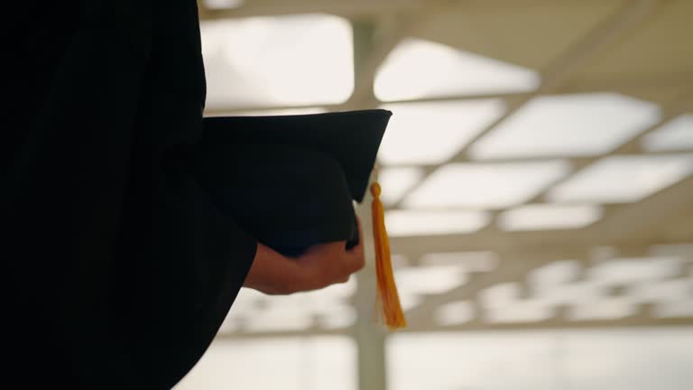 Graduation Congratulations student ceremony on the day of graduation at the university,Sunset Silhouette orange sky Slow motion 4K