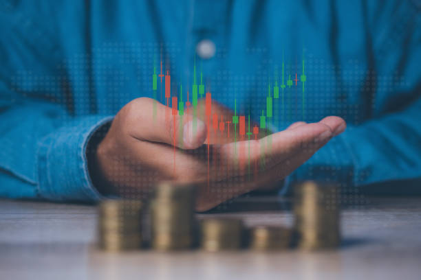 istock Businessman stacking coins with screen forex trading graph financial data. Goal business profit graph development. Stock market, financial growth report. 1615497930