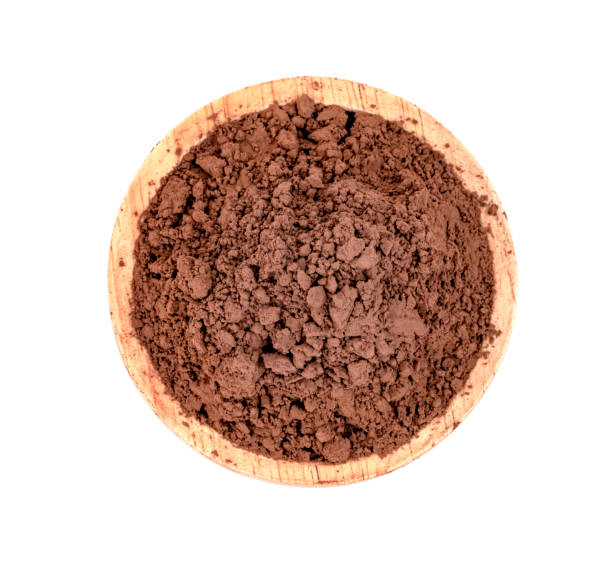 istock Cocoa powder with wooden bowl  isolated on white background 1615500494