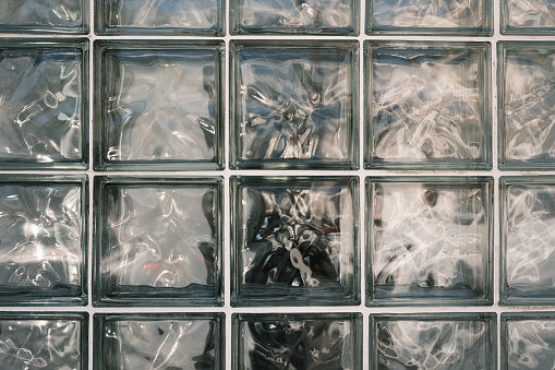 Close-up on a glass brick wall.