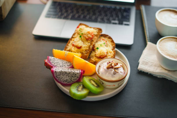 istock Breakfast toast with cheese and tomatoes, fruit, yogurt, coffee. 1615534545