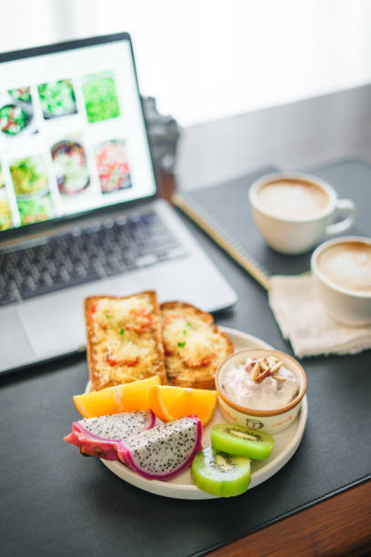 istock Breakfast toast with cheese and tomatoes, fruit, yogurt, coffee. 1615534559