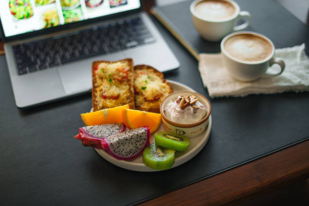 istock Breakfast toast with cheese and tomatoes, fruit, yogurt, coffee. 1615534824