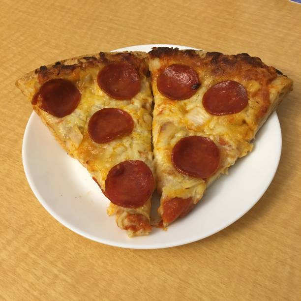 istock Slices of Pepperoni Pizza 1615546464
