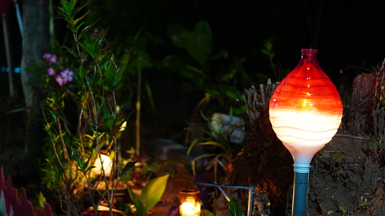 red and white oval garden lights made from used plastic bottles.