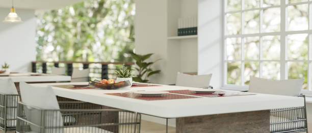 istock Close-up image of a beautiful white dining table in a beautiful luxury restaurant. 1615609975