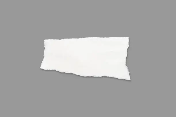 Photo of White ripped note,Torn paper edges for background. Ripped paper texture on transparent background. isolated on white background with clipping path.