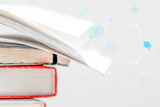 istock E book digital learning. Open book and scattered shapes and symbols. eLearning concept. 1615634917