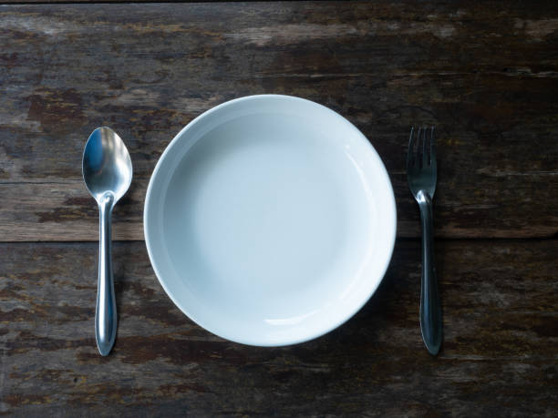 istock plate fork spoon wooden table white color silver background wallpaper kitchen meal restaurant dish lunch dinner rustic empty blank menu object drink eat cooking holiday object desk concept material 1615649436