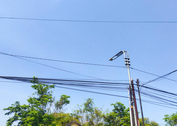 istock Sky street lamp pole and cable 1615661324