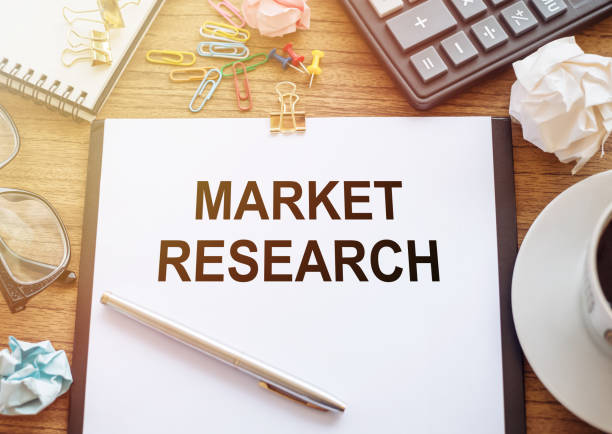 istock Market research concept. Text on notebook with office tools and cup of coffee 1615663304