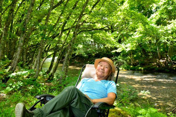 Senior man enjoying solo camping