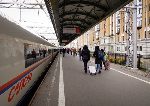 Saint Petersburg, Russia - Oct 5, 2016. Passengers walking at highspeed train station in Saint Petersburg, Russia. High-speed rail is emerging in Russia as an increasingly popular means of transport.