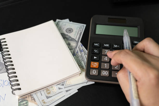 istock Paper note with text written PENSION PLAN, Calculator, Pen. 1615698094