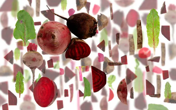 Abstract background made of Red Beet vegetable pieces, slices and leaves isolated on white.