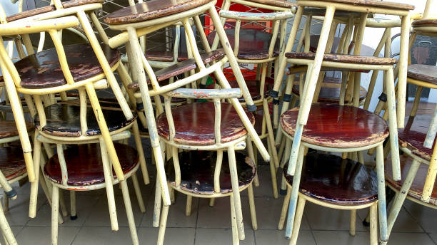 istock Stack of steel wooden chairs 1615760072