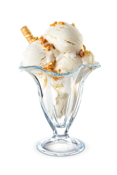 istock Vanilla ice cream scoops served on a tulip sundae glass cup isolated on white. 1615775298