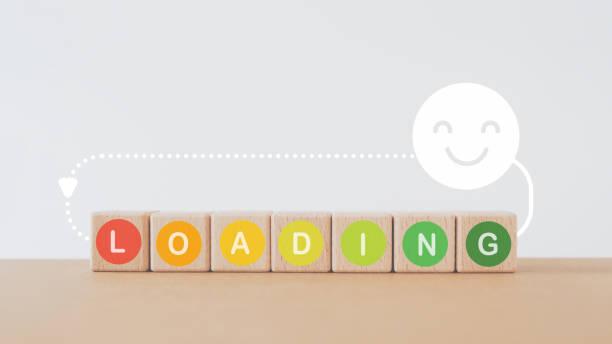 istock loading text in multi color circle on wooden cube block with smiling face above, for wellness, wellbeing, relaxation, vacation, good health concept 1615803747