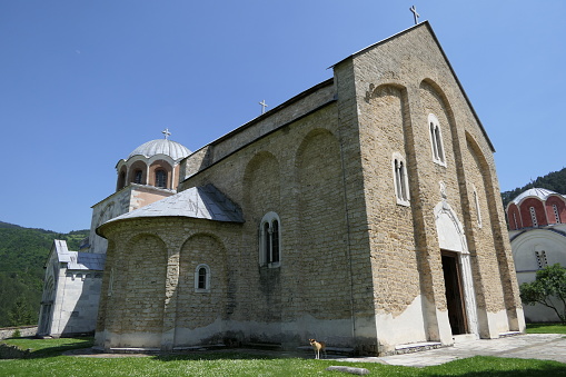 View at the bell towers and part of the church of the Catholic Maria Laach Abbey near Glees in Germany. The abbey dates back to the year1100 and is now a monastery of the Benedictine Confederation.