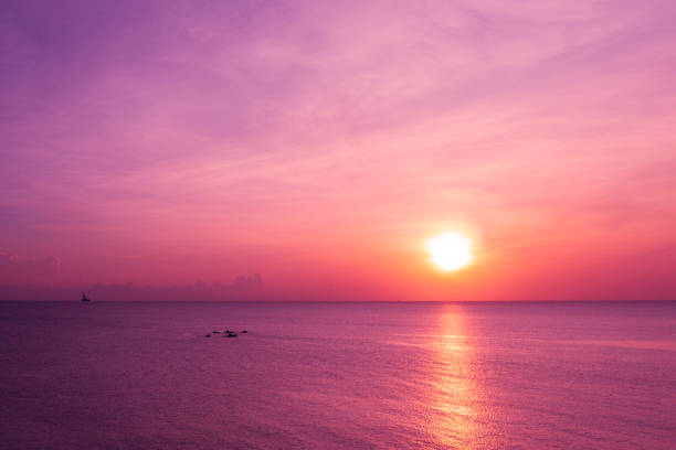 istock Early morning, pink sunrise over sea 1615880687