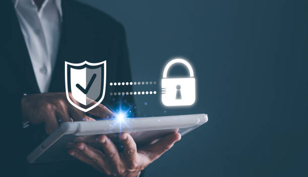 istock Cyber security. Business, technology, internet and networking concept. Young business man working on his laptop in the office, select the icon security on the virtual display. 1615882821