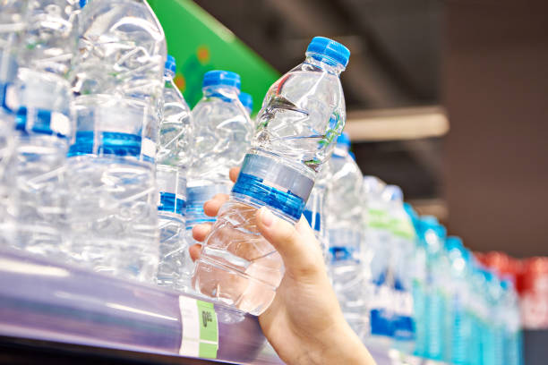 istock Drinking water in hand at shop 1615887211