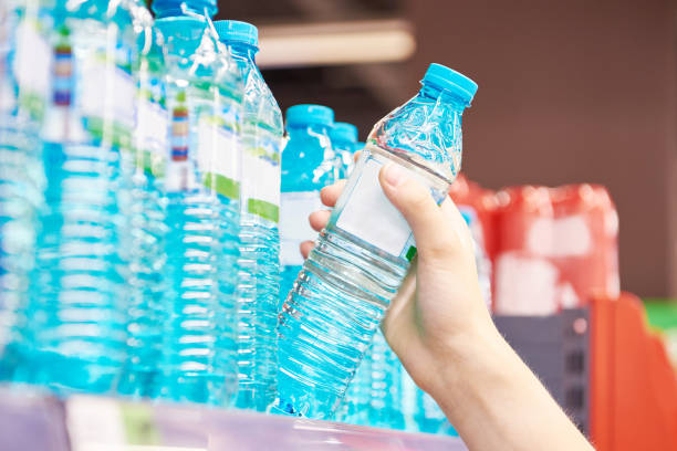 istock Drinking water in hand at shop 1615887764
