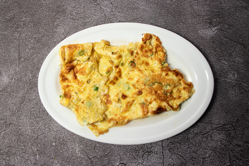 Dim Bhaji or egg omelet served in dish isolated on background top view of bangladesh food