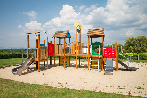 Outdoor colorful children playground in sunny day blue sky background. Child learning, self development, education concept.