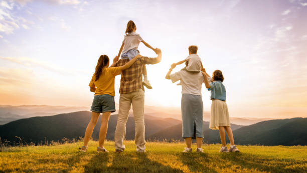 istock Happy family at sunset 1615905676