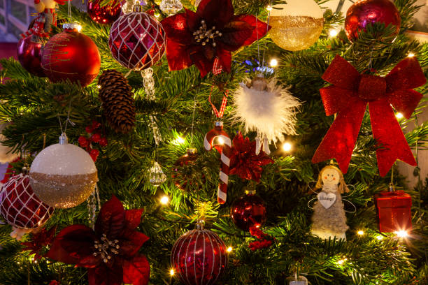 istock Colourful Christmas baubles and fairy lights, Christmas tree, 1615913916