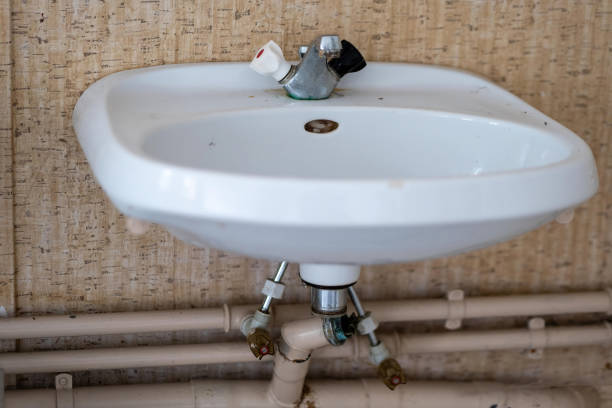 a dirty sink in an abandoned house