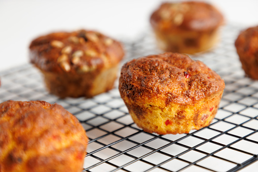 Close-up on baked crusty corn muffin served on grid