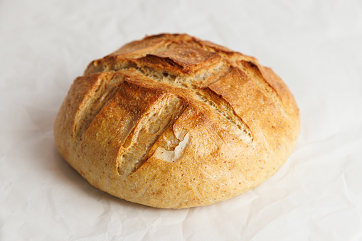 Close-up on beautifully baked bread with yellowish brown crust