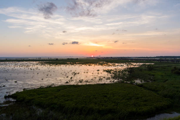 istock Beautiful sky at sunset over Mobile Bay, Alabama 1615998158