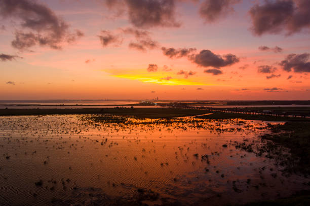 istock Beautiful sky at sunset over Mobile Bay, Alabama 1616000419