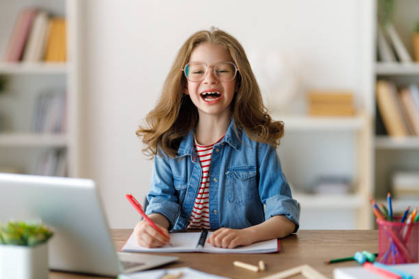 istock Girl doing homework or online education. 1616016013