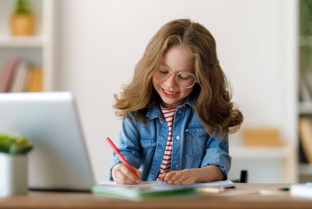 istock Girl doing homework or online education. 1616017417
