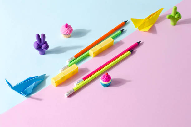 istock Creative background stationery. School erasers of different fores and colors on a two-tone background, selective focus 1616027334