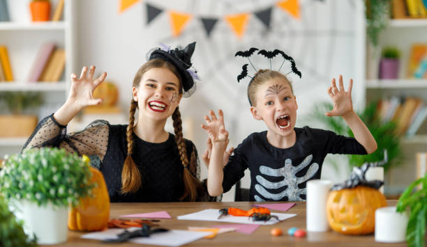 istock Happy family preparing for Halloween. 1616036034