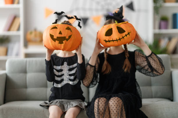 istock Happy family celebrating Halloween. 1616036606