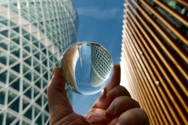 Crystal ball against modern buildings