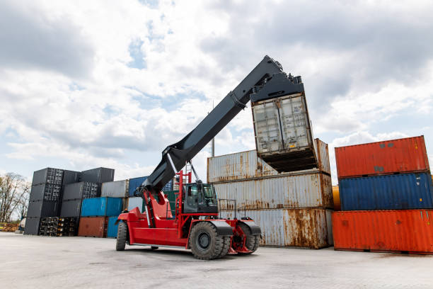 istock A forklift truck is in the process of loading a train with containers, facilitating logistics for shipping, import-export, or transportation purposes. 1616044009
