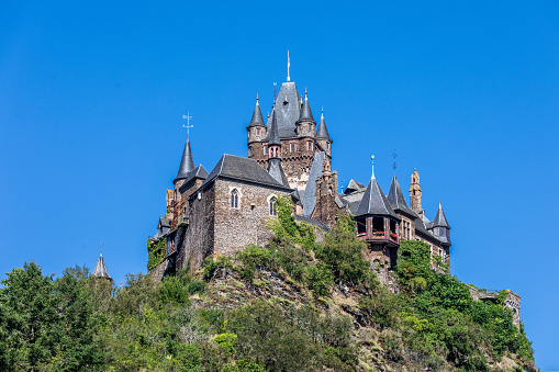 Cochem, Germany - August 1st 2023: Cochem with Imperial Castle. \n\nAbout Cochem:  Cochem is the seat of and the biggest town in the Cochem-Zell district in Rhineland-Palatinate, Germany. With just over 5,000 inhabitants, Cochem falls just behind Kusel, in the Kusel district, as Germany's second smallest district seat. Since 7 June 2009, it has belonged to the Verbandsgemeinde of Cochem.\nSource: Wikipedia