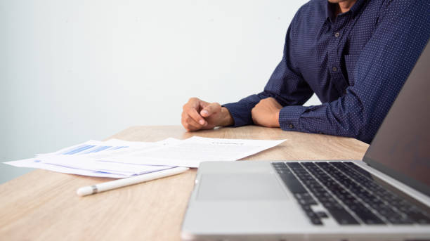 istock Businessman working at office with digital tablet, laptop computer, smart phone. Professional investor connection internet application online. Businessman review annual company report. 1616090543