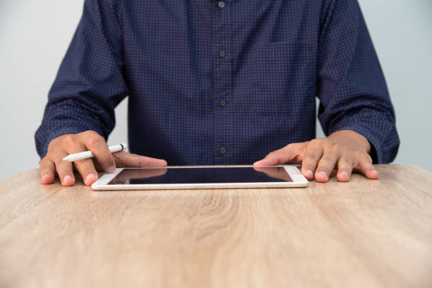 istock Businessman working at office. Digital tablet connection internet application online. 1616090994