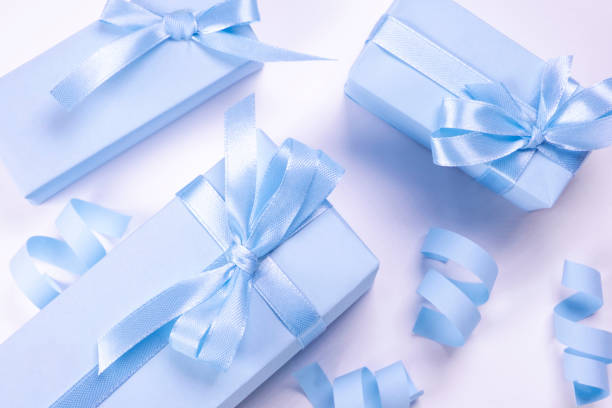 istock blue gift boxes with blue bows on a white background, top view, the concept of celebrating a boy or man's birthday, a party or an anniversary or a newborn 1616105558